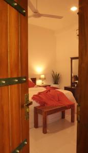 Postel nebo postele na pokoji v ubytování The Cattleya Guest House Sigiriya