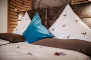 Postel nebo postele na pokoji v ubytování Hotel Leitner