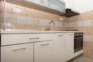 Kuchyňa alebo kuchynka v ubytovaní Apartment Bareta