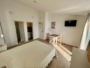 Televízia a/alebo spoločenská miestnosť v ubytovaní Apartment Via