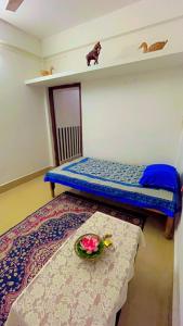 Ένα ή περισσότερα κρεβάτια σε δωμάτιο στο Kunkunpaati