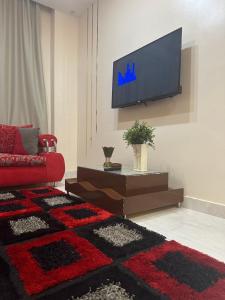 TV a/nebo společenská místnost v ubytování Karma Kono