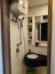 a small bathroom with a toilet and a sink at Apartemen Sky House BSD in Cilenggang