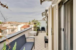 a balcony with a bench and a view of a city at Casa Vacanza LaReggia con garage in San Prisco