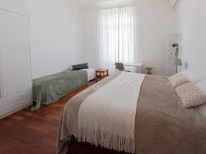Letto o letti in una camera di I Host Apartment - Orti 16 Scala D
