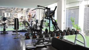 a gym with a lot of exercise equipment in a room at Sugar Marina Hotel - FASHION - Kata Beach in Kata Beach