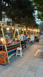 a market with a boat on display on a sidewalk at 부산 서면 레지던스 신축 힐링 하우스 in Busan