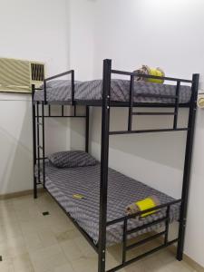 Postel nebo postele na pokoji v ubytování AL SHAMS MUSCAT MALE hostel + 27 fotografií