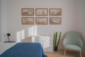 A bed or beds in a room at La Guardiola - Capo Perla
