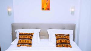 Postel nebo postele na pokoji v ubytování Studio meublé haut standing jouvence Yaoundé
