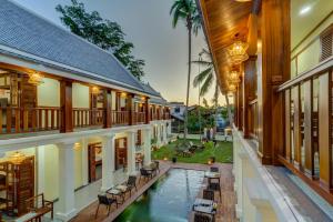 an aerial view of the courtyard of a house with a swimming pool at Elegant Boutique Hotel Luangprabang in Luang Prabang