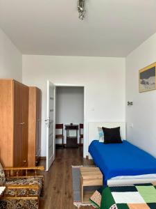 Ένα ή περισσότερα κρεβάτια σε δωμάτιο στο Apartament Koszary +5 φωτογραφίες