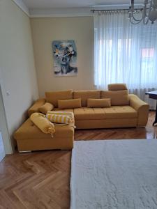 a living room with a couch and a table at Aurelia in Vinkovci