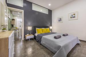 Ένα ή περισσότερα κρεβάτια σε δωμάτιο στο Spinola Bay Hideaway