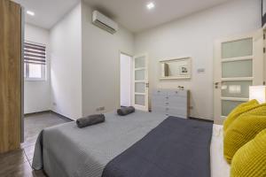 Ένα ή περισσότερα κρεβάτια σε δωμάτιο στο Spinola Bay Hideaway +13 φωτογραφίες