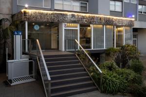 a building with stairs in front of a building at Hotel Rali Viana in Viana do Castelo