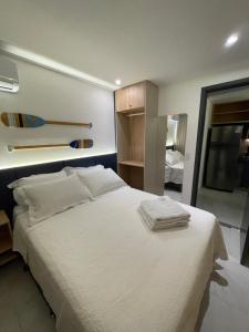 En eller flere senge i et værelse på Makadamia- Cantinho do mar Beira-mar em Porto de Galinhas + 35 billeder