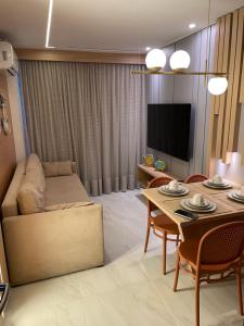 Et tv og/eller underholdning på Makadamia- Cantinho do mar Beira-mar em Porto de Galinhas