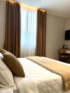 Postel nebo postele na pokoji v ubytování Solea Hotel