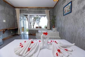Postel nebo postele na pokoji v ubytování Cosian Bay Phu Quoc Resort