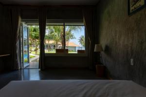 Postel nebo postele na pokoji v ubytování Cosian Bay Phu Quoc Resort