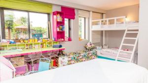 a kids room with bunk beds and a bed at Villa luxeuse et climatisee sur le golf, piscine chauffee in Essaouira +64 photos