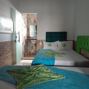 Postel nebo postele na pokoji v ubytování Hotel Sebastian