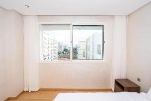 Una cama o camas en una habitación de Appartement géant
