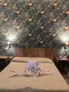 Postel nebo postele na pokoji v ubytování Hotel Ai Tufi