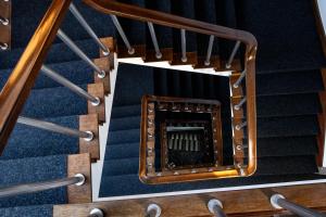 an overhead view of stairs in a building at Hotel Rali Viana in Viana do Castelo