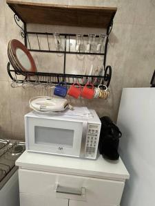 Η κουζίνα ή μικρή κουζίνα στο Ap Aconchegante Catanduva II