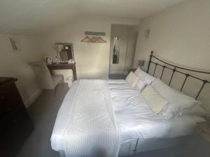 Postel nebo postele na pokoji v ubytování Amberley Inn