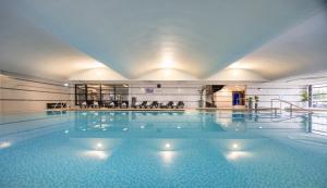 a large swimming pool in a building at Crowne Plaza Liverpool City Centre by IHG in Liverpool