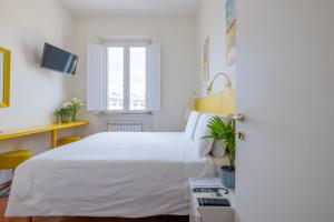 A bed or beds in a room at Superior Relais FCollection Temple View