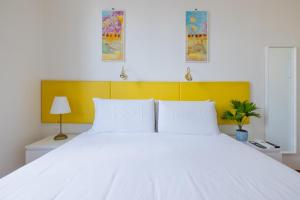 A bed or beds in a room at Superior Relais FCollection Temple View