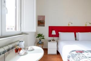 A bed or beds in a room at Superior Relais FCollection Temple View