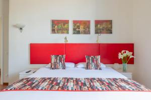 A bed or beds in a room at Superior Relais FCollection Temple View