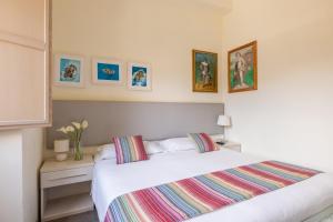 A bed or beds in a room at Superior Relais FCollection Temple View