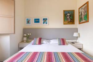A bed or beds in a room at Superior Relais FCollection Temple View