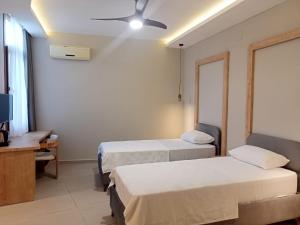 Postel nebo postele na pokoji v ubytování Casalita Hotel