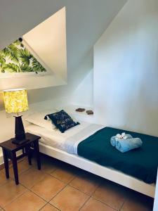 Postel nebo postele na pokoji v ubytování TI COCOTIER Appartement VUE MER 2 à 6 personnes village Pierre et vacances + 33 fotografií