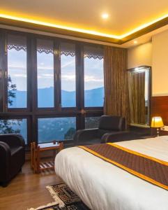 Ένα ή περισσότερα κρεβάτια σε δωμάτιο στο Hotel Lha-yul nearby MG Road Gangtok