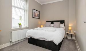 En eller flere senge i et værelse på Number 3 Castle Cottage