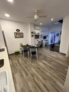 a living room with a table and chairs at Galatea Puerto Sherry Apartamento in El Puerto de Santa María