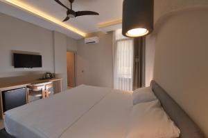 Postel nebo postele na pokoji v ubytování Casalita Hotel