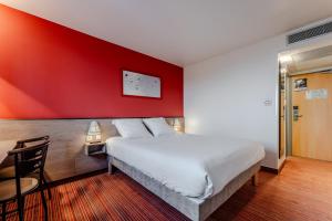 Postel nebo postele na pokoji v ubytování Ace Hotel Noyelles