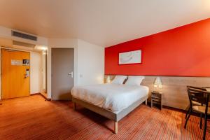 Postel nebo postele na pokoji v ubytování Ace Hotel Noyelles