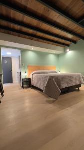 a bedroom with a large bed in a room at Charcas Suites Palermo Soho in Buenos Aires