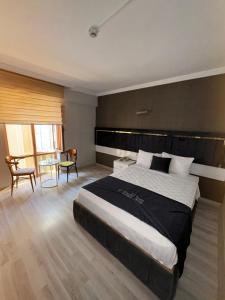 Postel nebo postele na pokoji v ubytování Yilmazel Hotel