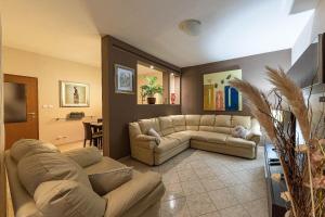 a living room with two couches and a couch at Villa Antonija in Ražanj